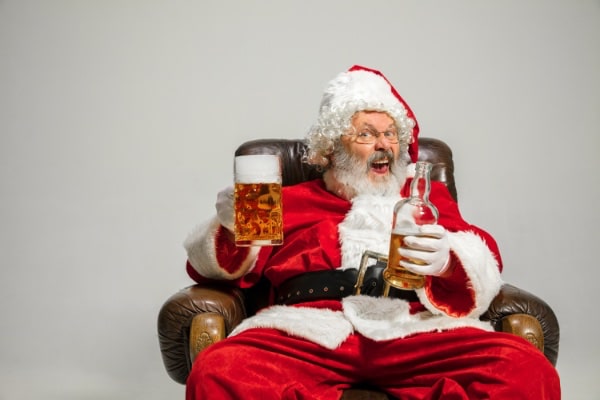 Santa sitting having a pint of beer